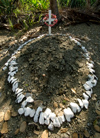 Recent gravesite with conch shell border