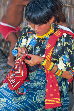 Guna Yala woman sewing a mola, Panama